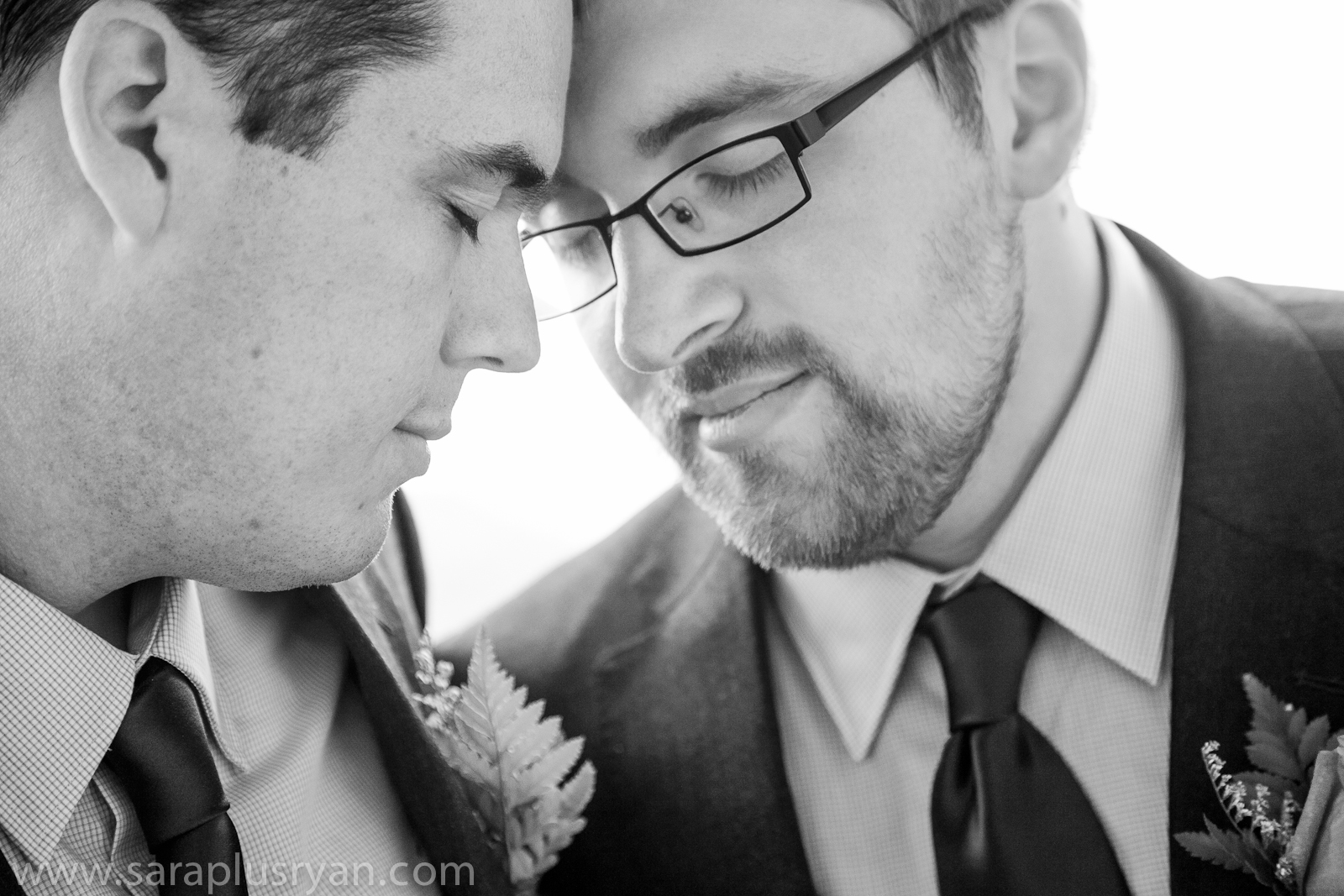 24 gay men wedding portrait resting foreheads closed eyes