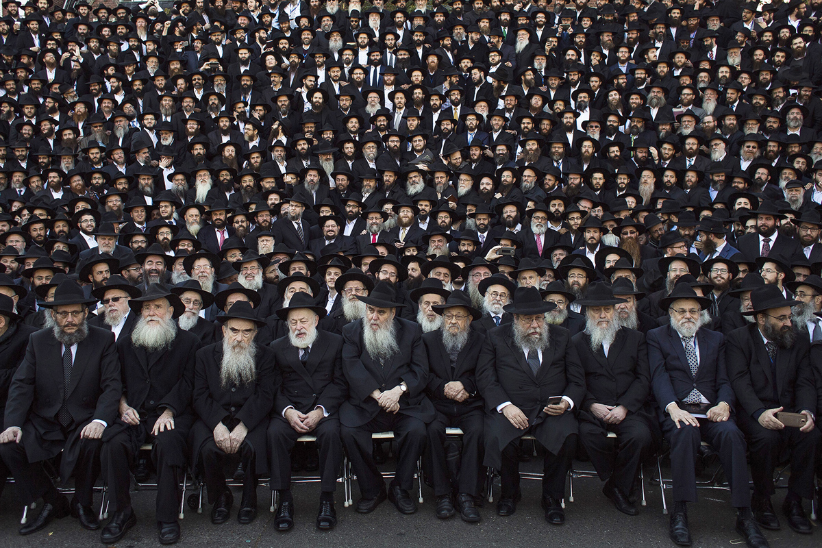 Thousands of Lubavitch rabbis from 86 countries prepare for their group photo to be taken near Chabad-Lubavitch headquarters in the Brooklyn borough of New York, Sunday, Nov. 8, 2015. The group is in New York for the International Conference of Chabad-Lubavitch Emissaries, an annual event aimed at reviving Jewish awareness and practice around the world. (AP Photo/Andres Kudacki)