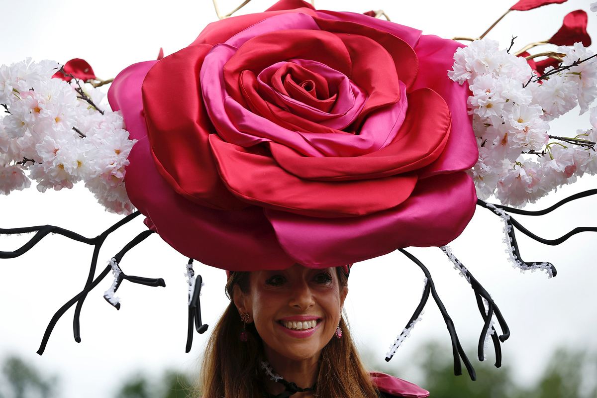 A racegoer poses for a picture during Ladies day at Royal Ascot in Ascot, west of London on June 16, 2016. 
