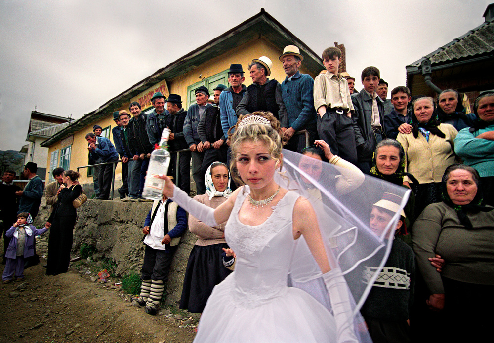 the-vodka-bride-wedding-in-maramures-romania-in-this-very-traditional-county-a-bride-offers-a-shot-of-liquor-to-the-people-the-couple-is-working-in-the-eu-but-they-came-home-for-the-wedding