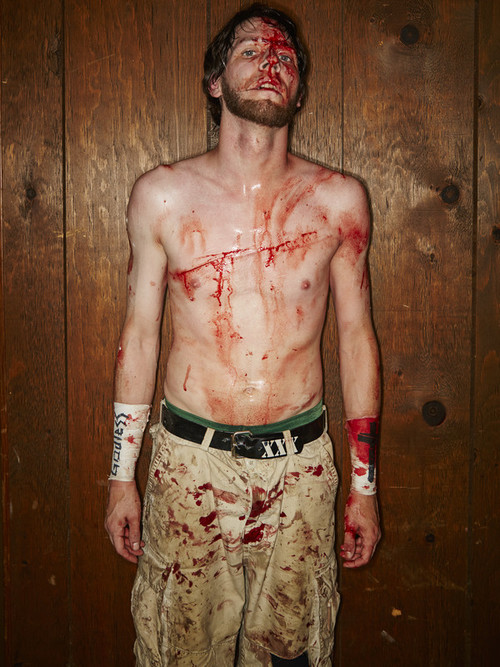 Wrestler Adam Bueller backstage after his match at the 2015 IWA Mid-South Royal Weekend of Death. His chest wound was superglued back together.